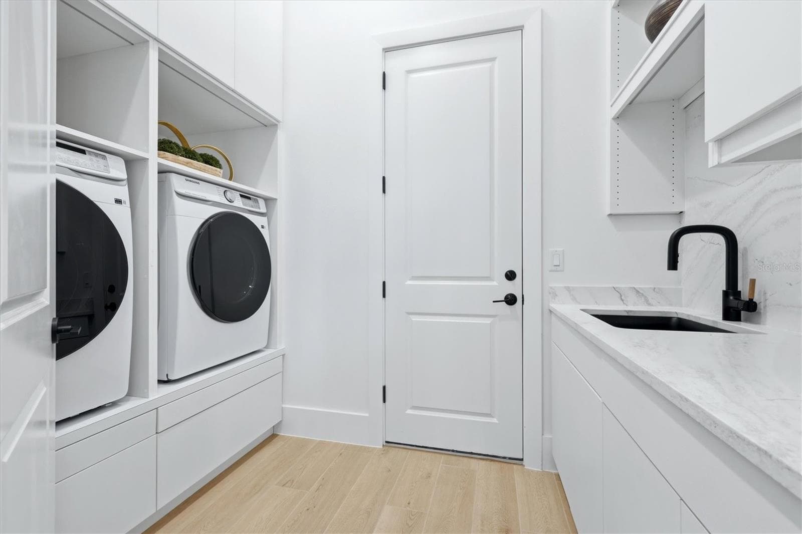 laundry rm with extra cabinets - 6264 CHAMPIONS ROW ST, BRADENTON