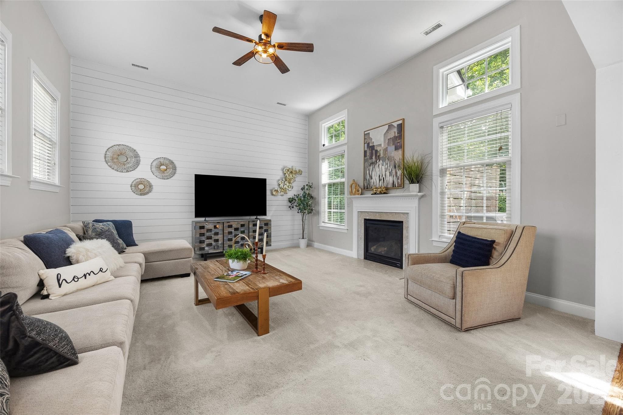 Large bright family room with fireplace and shiplap detail - 2209 Trading Ford Drive, Waxhaw