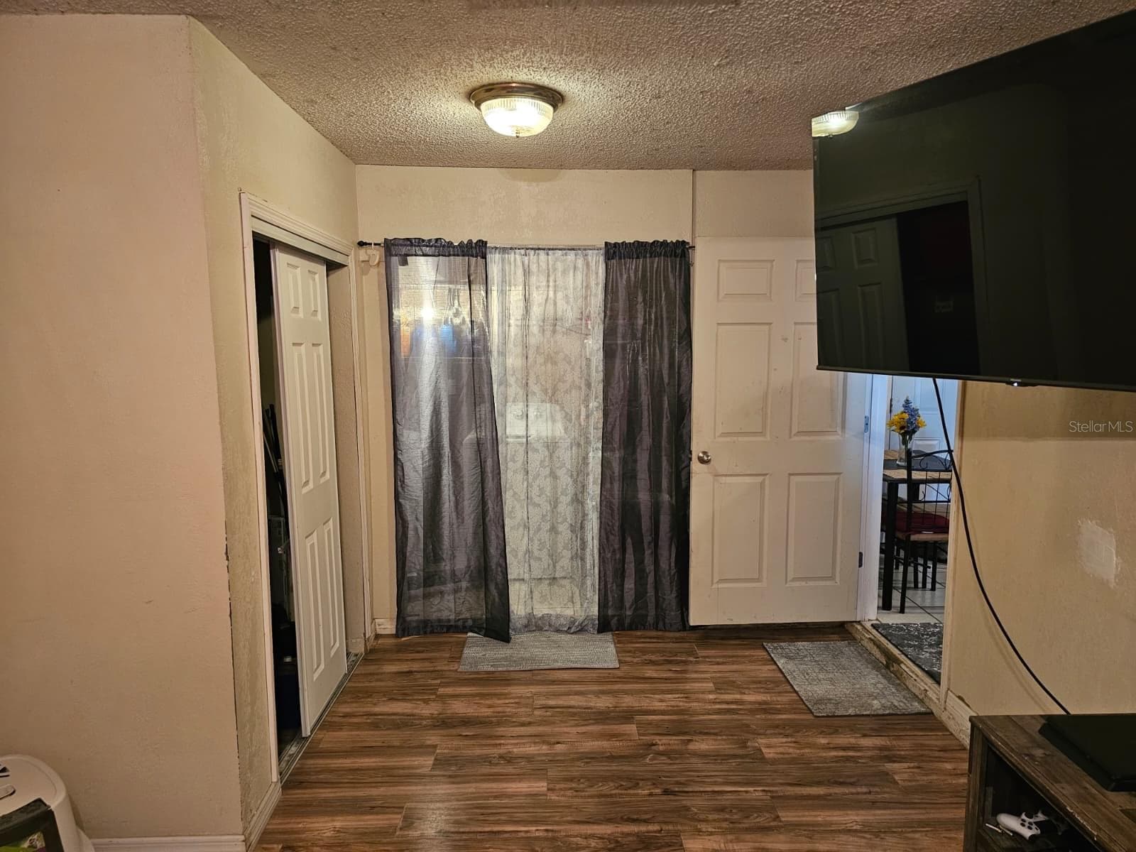 Family room, craft room and laundry area - 5203 SE 114TH ST, BELLEVIEW