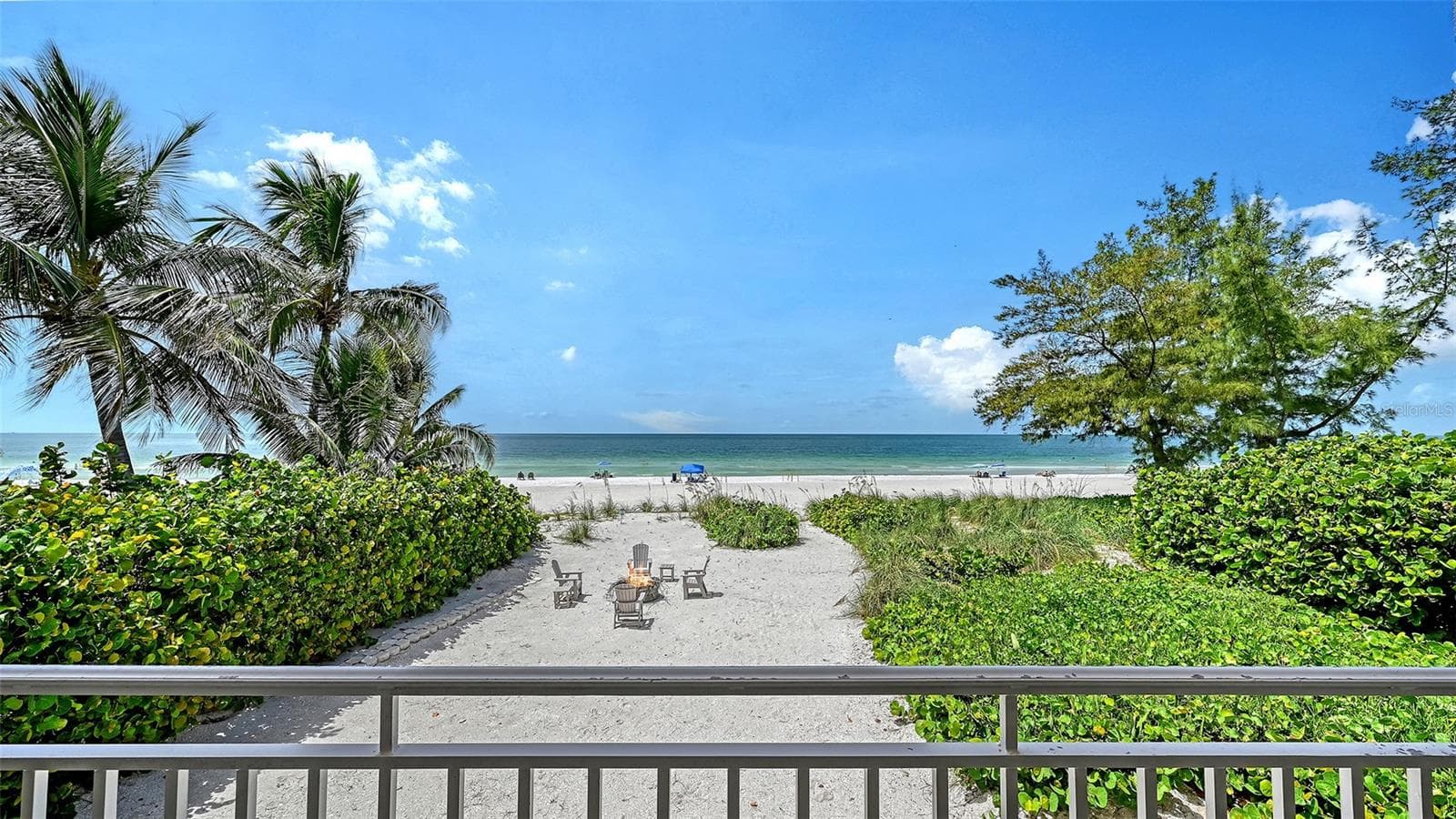 View from the living room of the private beach and the public beach past the sea oats. - 106 74TH ST #100, HOLMES BEACH