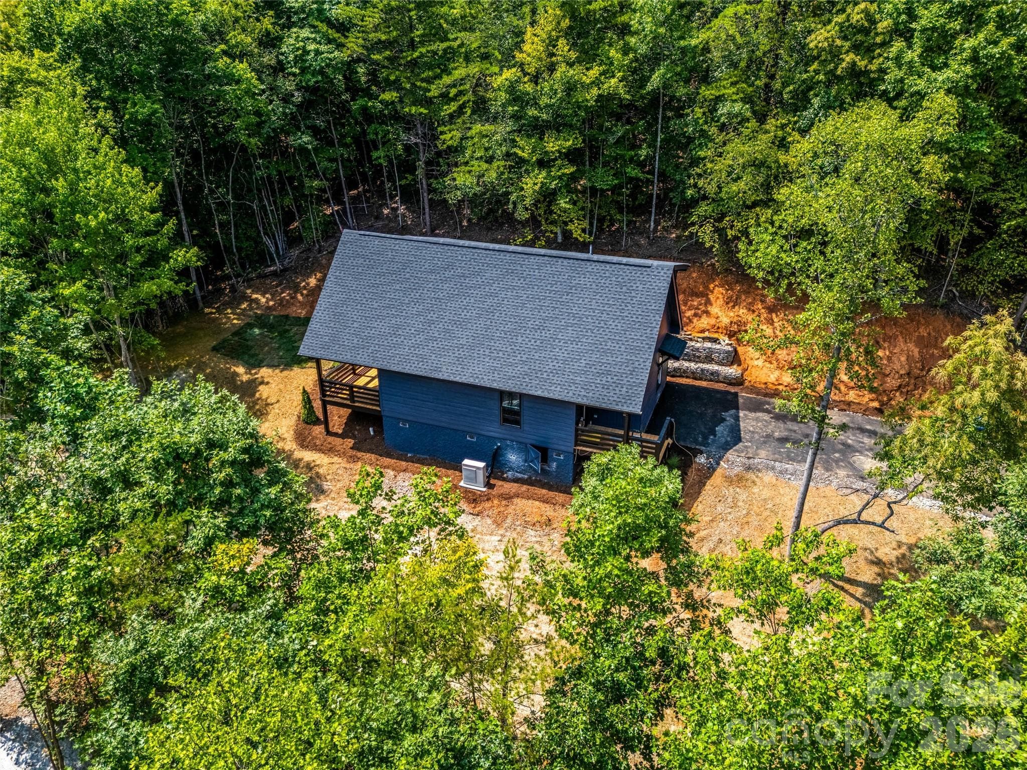 Aerial view of home and wooded setting - 87 Catatoga Trail, Marion