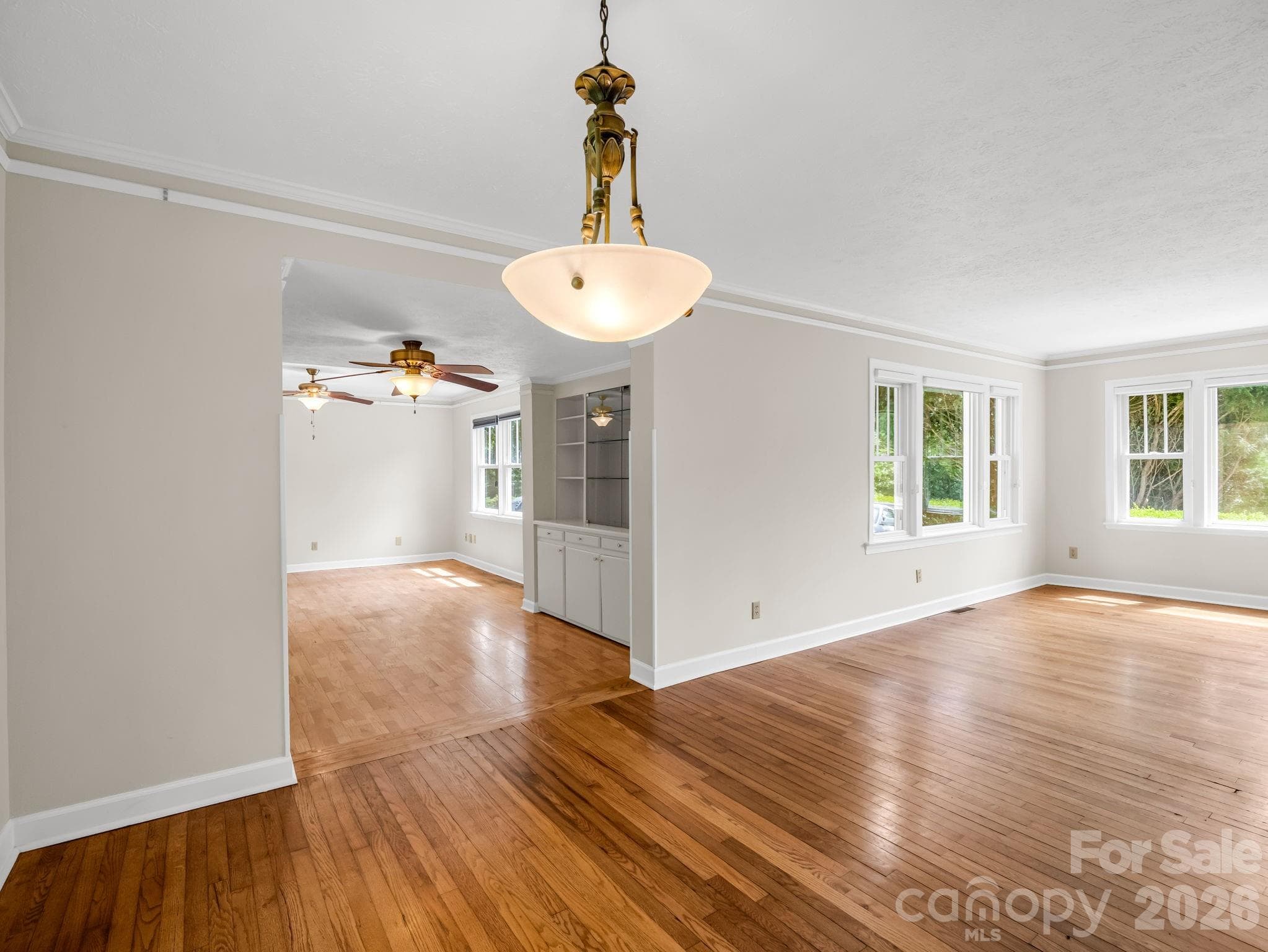 Lots of charm with the hardwood floors and built in cabinets. - 370 Orchard Circle, Laurel Park