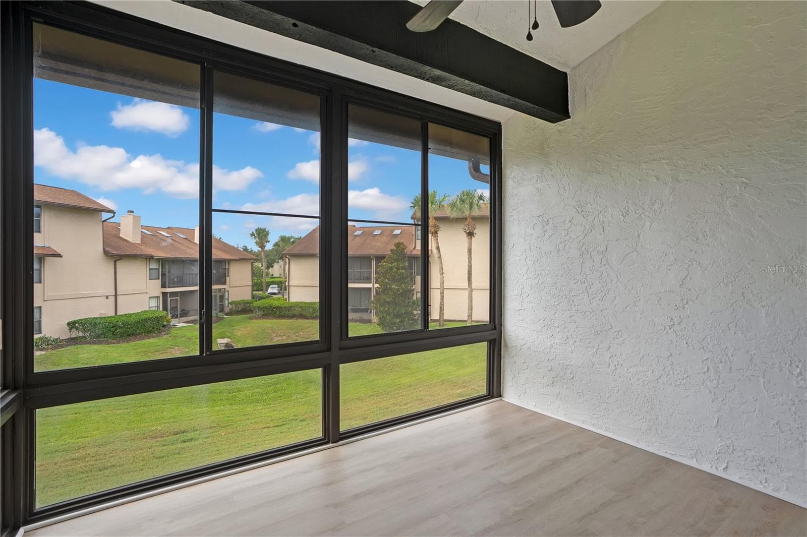 Screened-in private balcony provides the perfect space to relax and enjoy the Florida weather. - 3012 S SEMORAN BLVD #G2, ORLANDO