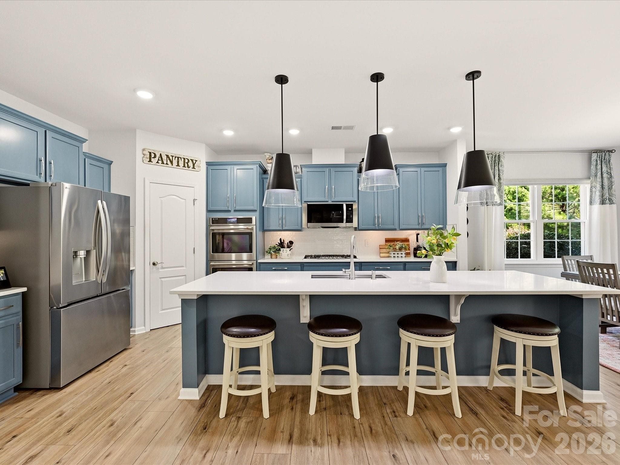 Large Center Island, Quartz Counters, Walk in Pantry with Solid Shelving. Pull out Shelving on Lower Cabinets - 5060 Big Bend Drive, Lancaster