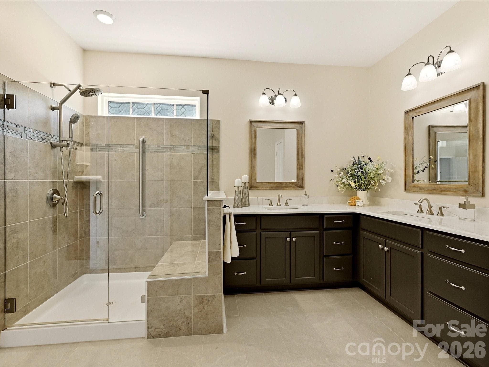 HEATED TILED FLOORS in Primary Bath! Quartz Counters, Framed Mirrors, Painted Cabinets, Shower w/ Frameless Shower Door, Tiled Surround, Grab Bars, Bench Seat and Upgraded Shower Attachment - 5060 Big Bend Drive, Lancaster