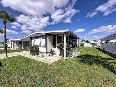 Mobile Home at 213 LAKESIDE RANCH CIR, WINTER HAVEN, photo 2 of 11