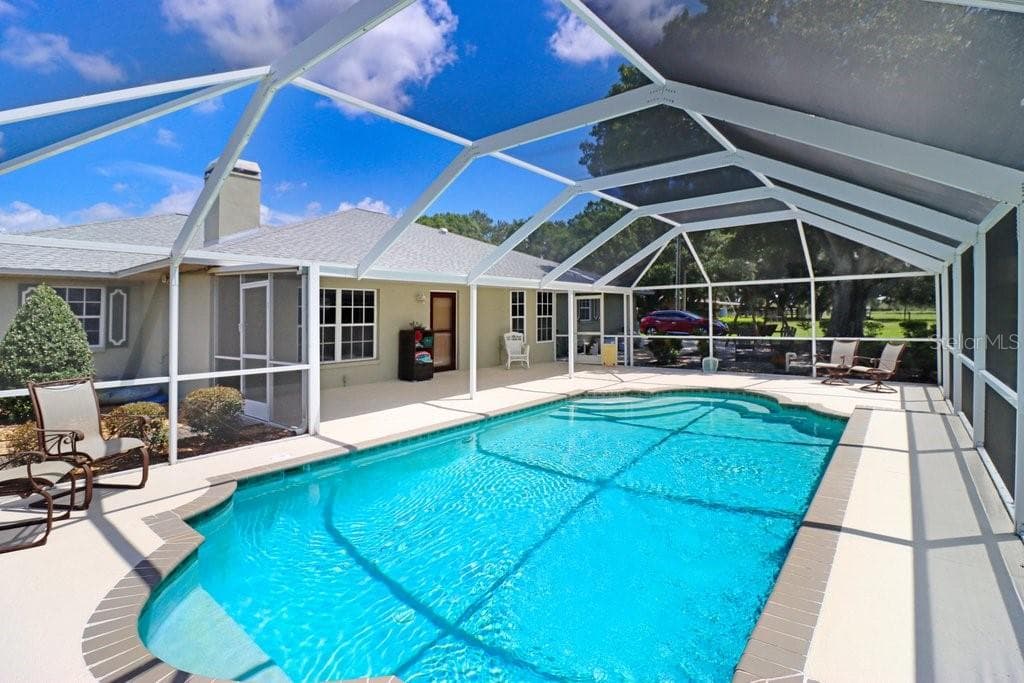 Pool with screened lanai - 13221 TOM GALLAGHER RD, DOVER