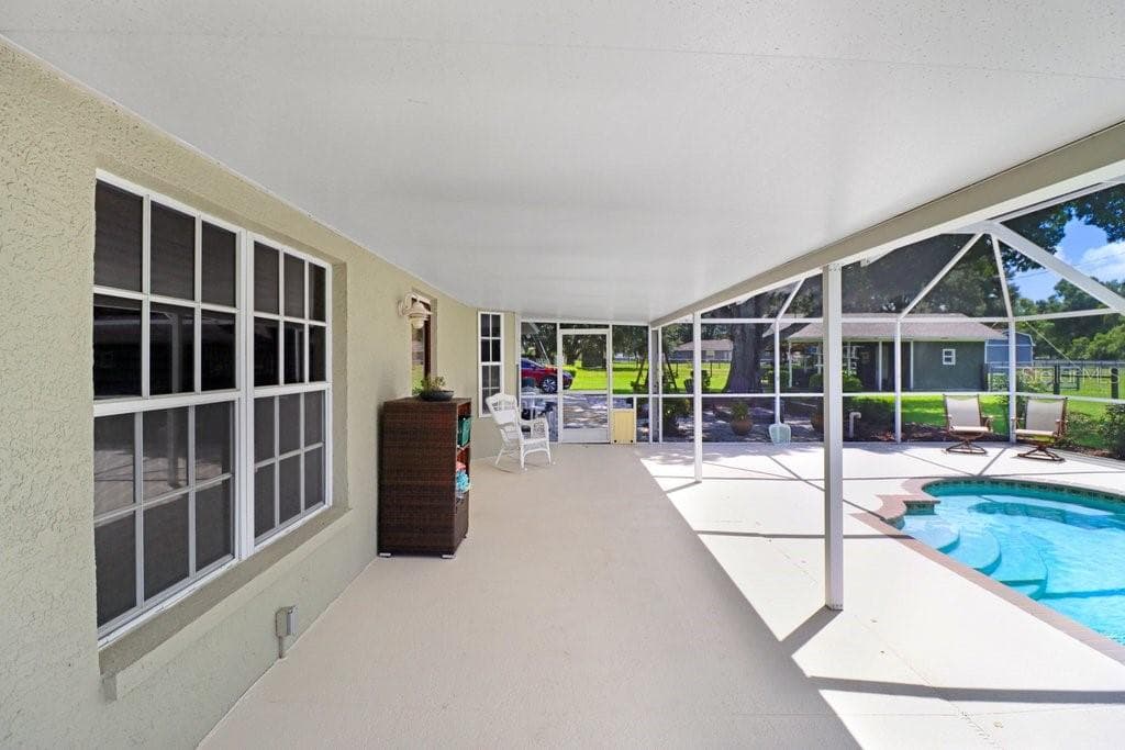 Pool and screened lanai - 13221 TOM GALLAGHER RD, DOVER