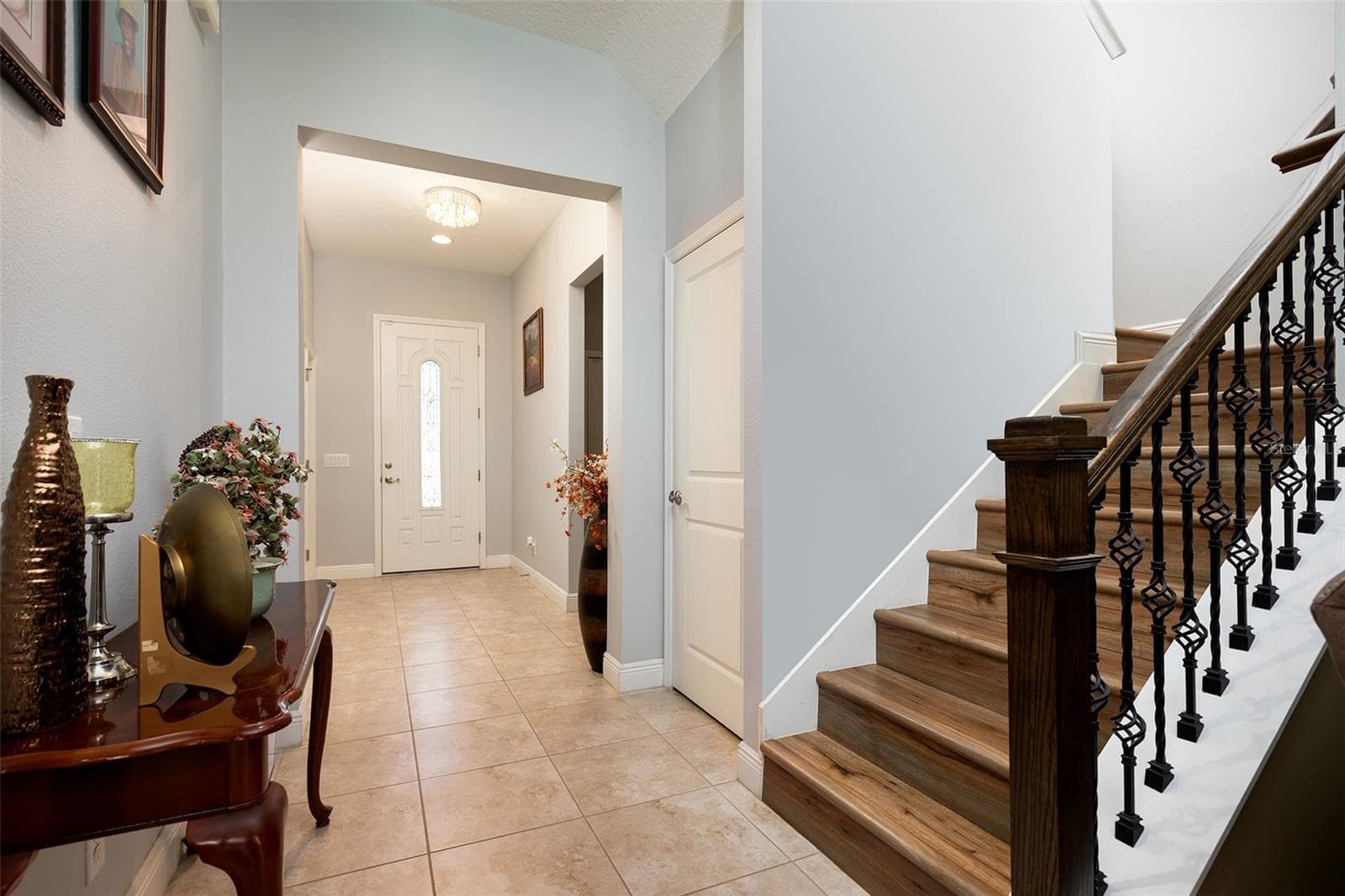 Front foyer-the laundry room is to one side and the half bath and storage closet is to the other - 995 KARST TREE LN, APOPKA