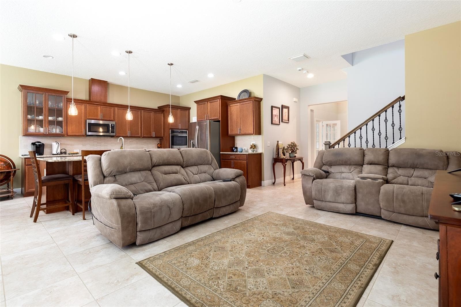 Spend time with all the important people in your life in this open concept living room and kitchen. - 995 KARST TREE LN, APOPKA