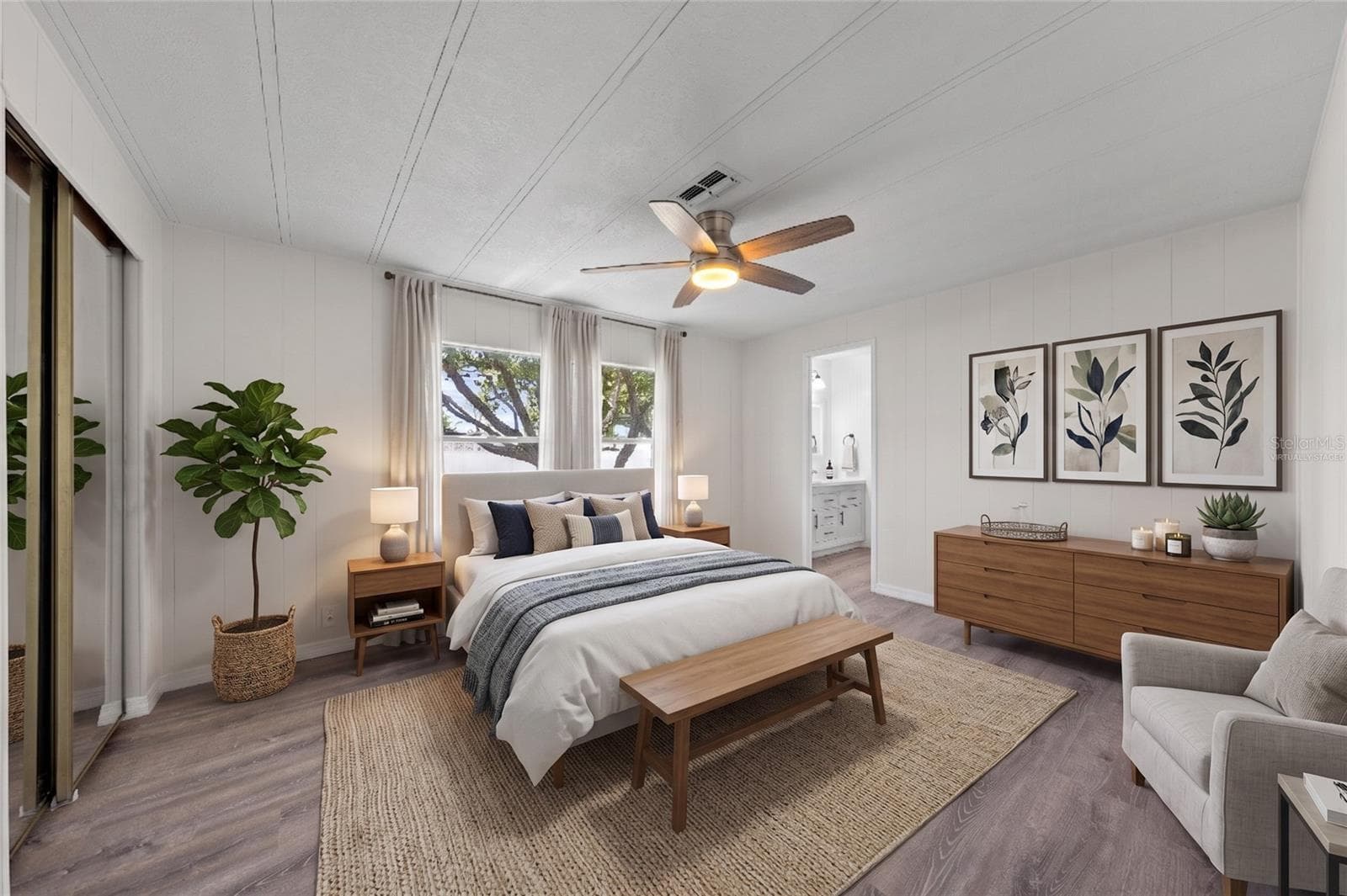 Virtually staged. Primary bedroom with full bathroom seems just right. - 5601 LAKE LIZZIE DR, ST CLOUD