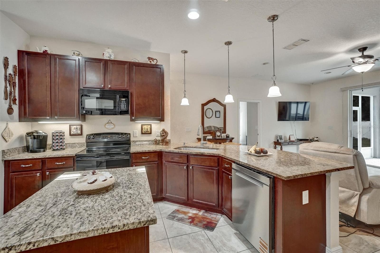 KitchenKitchen with ample cabinetry, granite countertops, and convenient storage. - 1720 LADY FERN TRL, DELAND