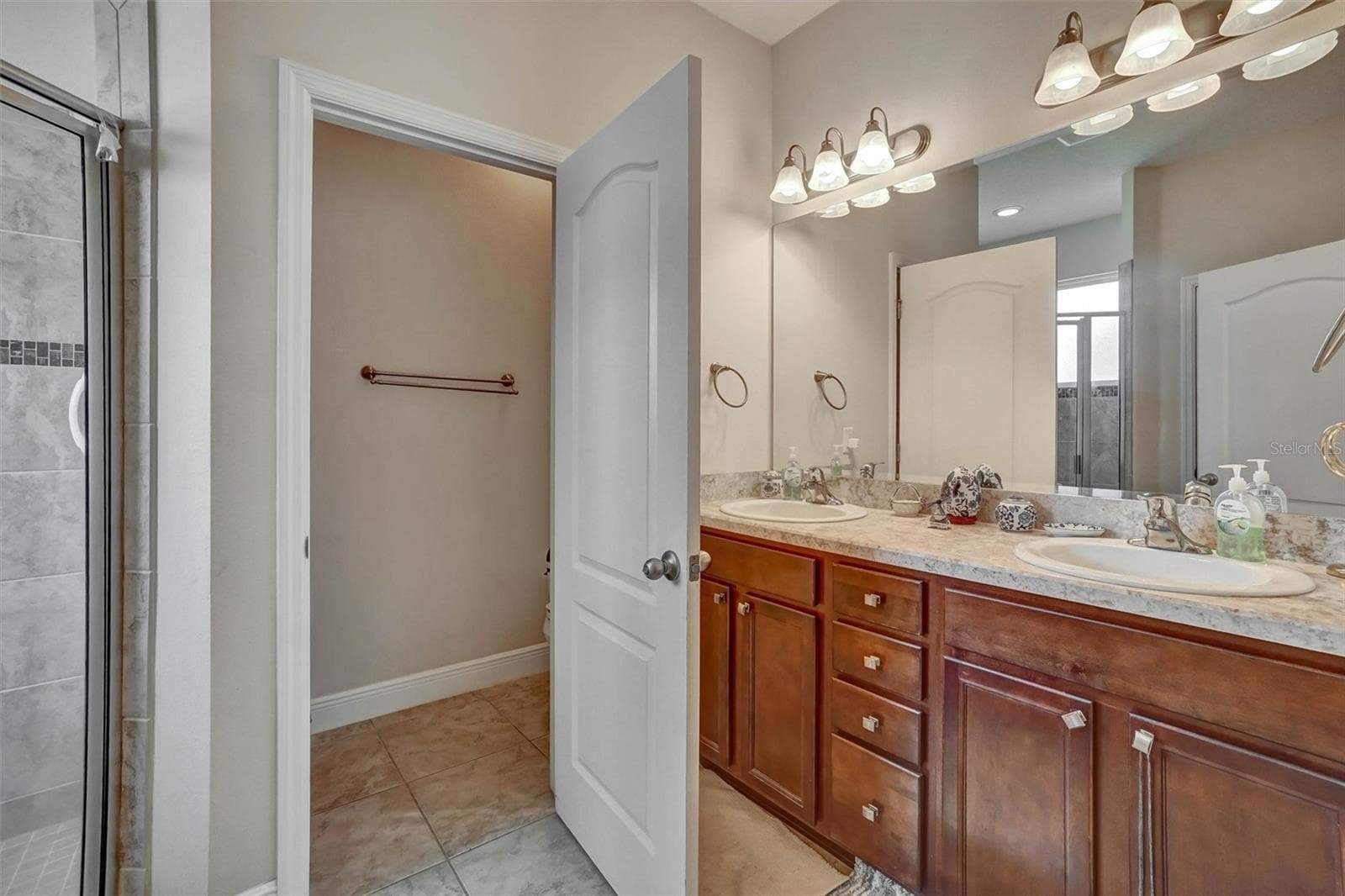 Primary Bathoom Dual vanity countertops and a large walk in shower - 1720 LADY FERN TRL, DELAND