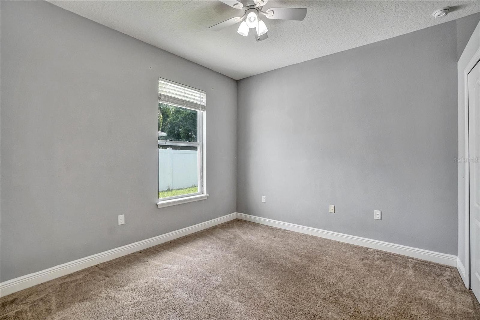 Fourth BedroomSpacious fourth bedroom with a neutral interior and plenty of room for furnishings. - 1720 LADY FERN TRL, DELAND