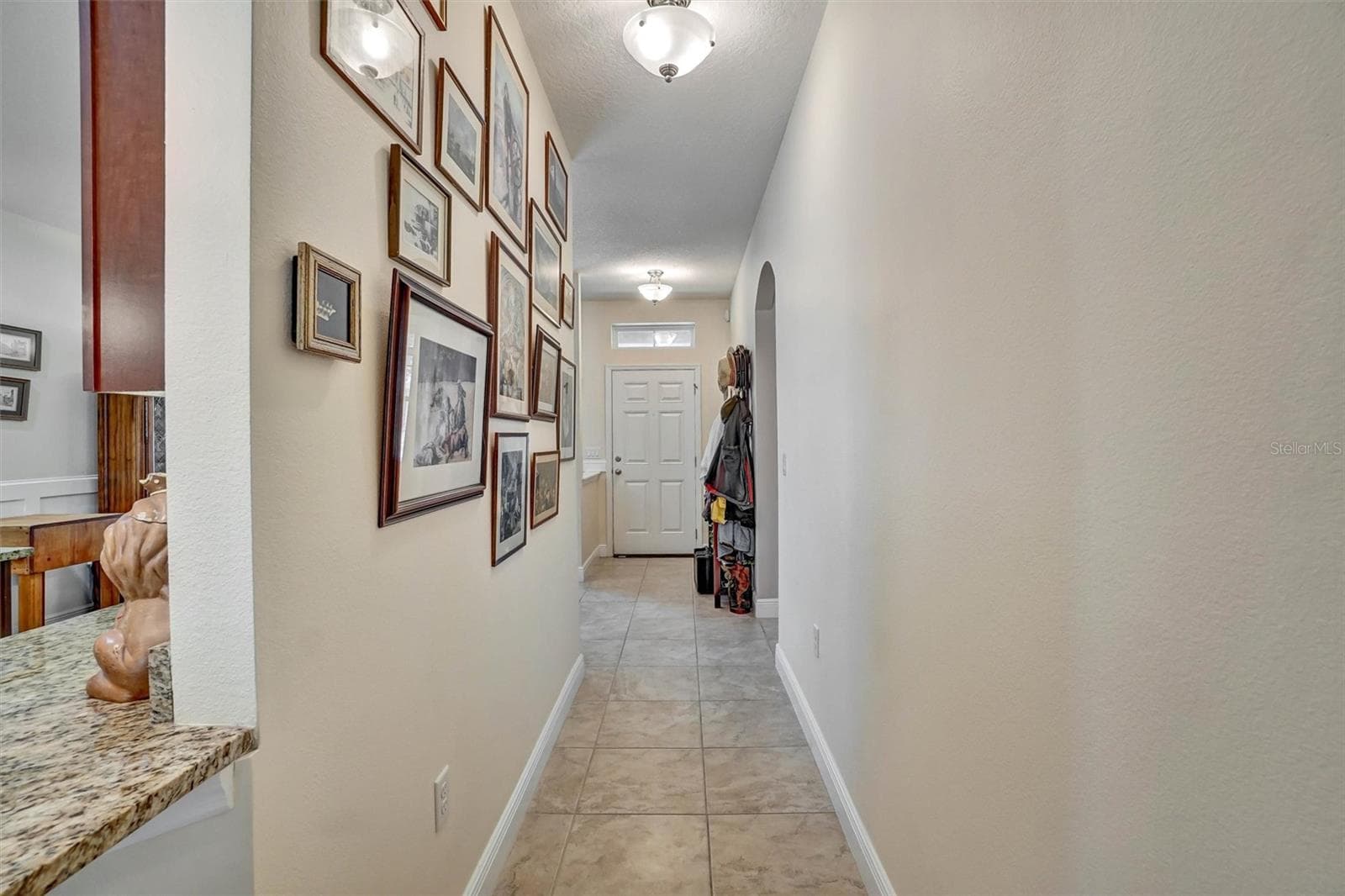 Hallway from front door to living room - 1720 LADY FERN TRL, DELAND