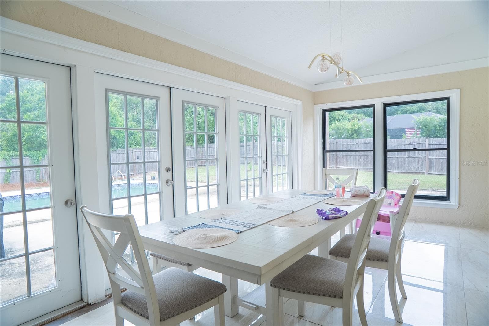 Dining room at 304 Shadow Oak Drive, a four-bedroom pool home for sale in Casselberry, Florida - 304 SHADOW OAK DR, CASSELBERRY