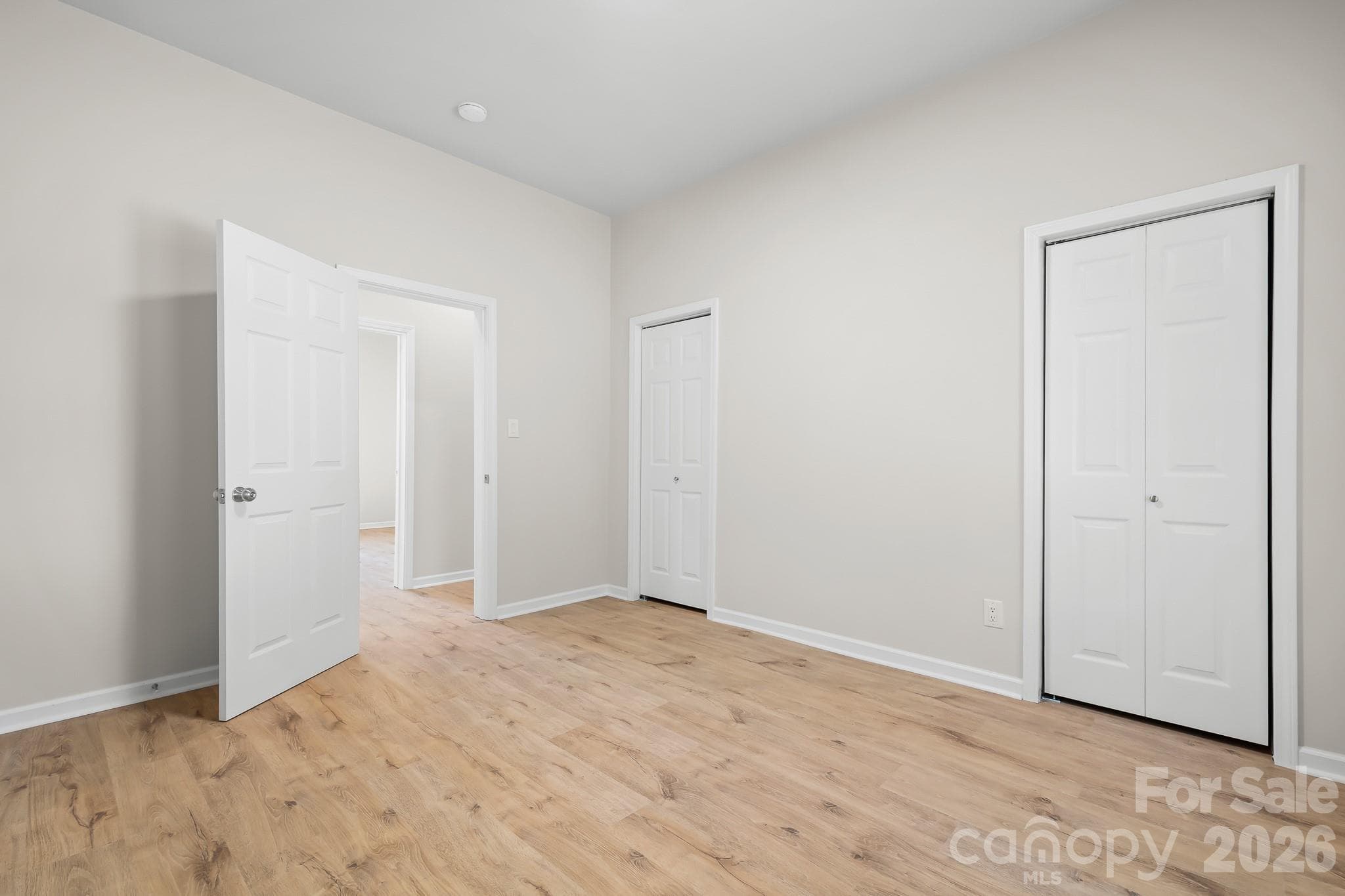 Spacious primary bedroom with two closets. - 104 1st Avenue, China Grove