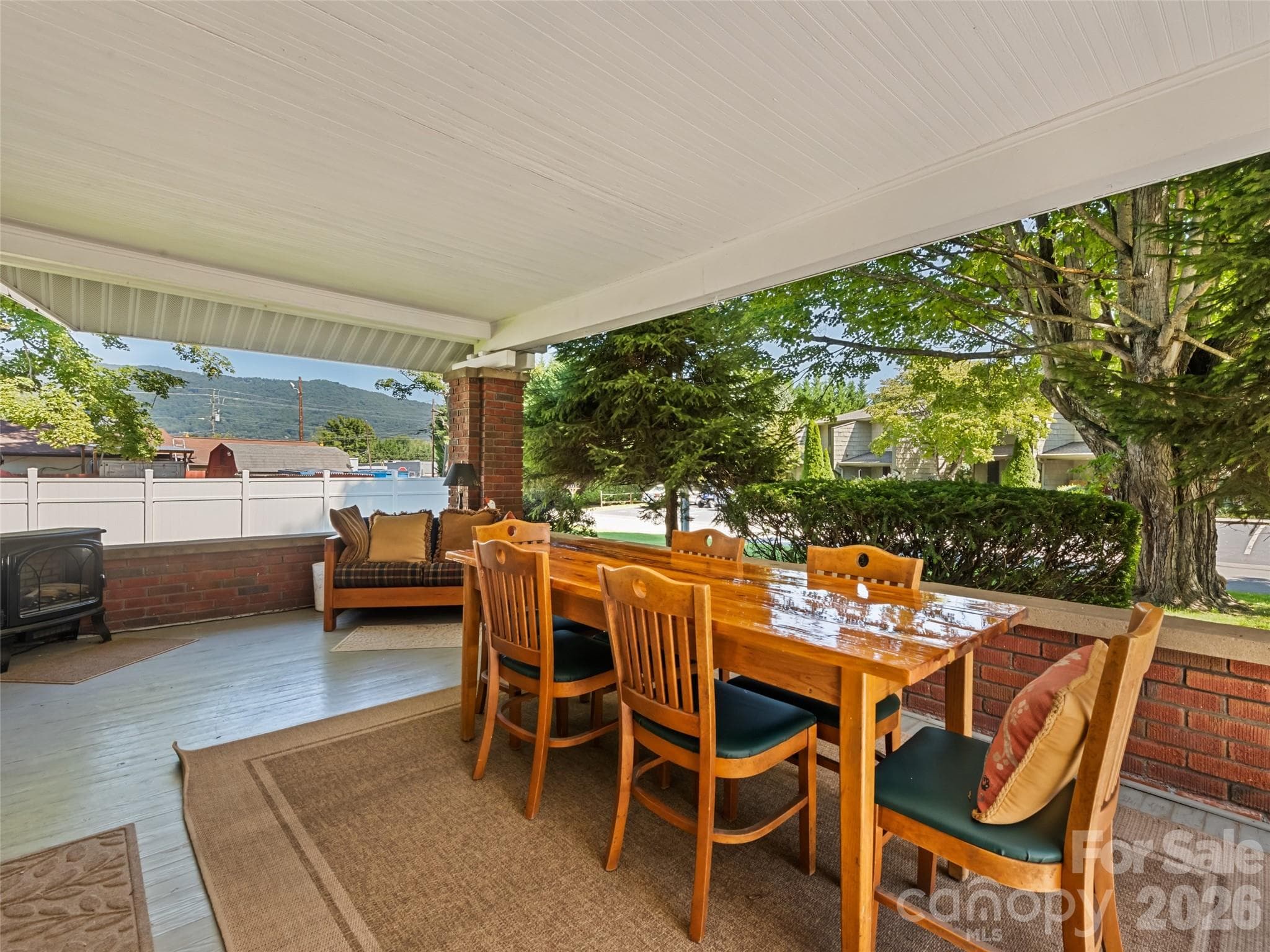 Covered front patio for drinking coffee in the mornings or catching the breeze in the evenings - 50 Epsom Street, Waynesville