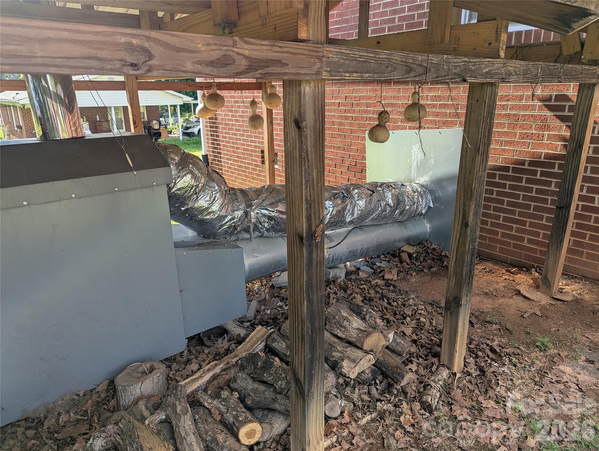 exterior woodstove - 605 Lincoln Lane SW, Lenoir