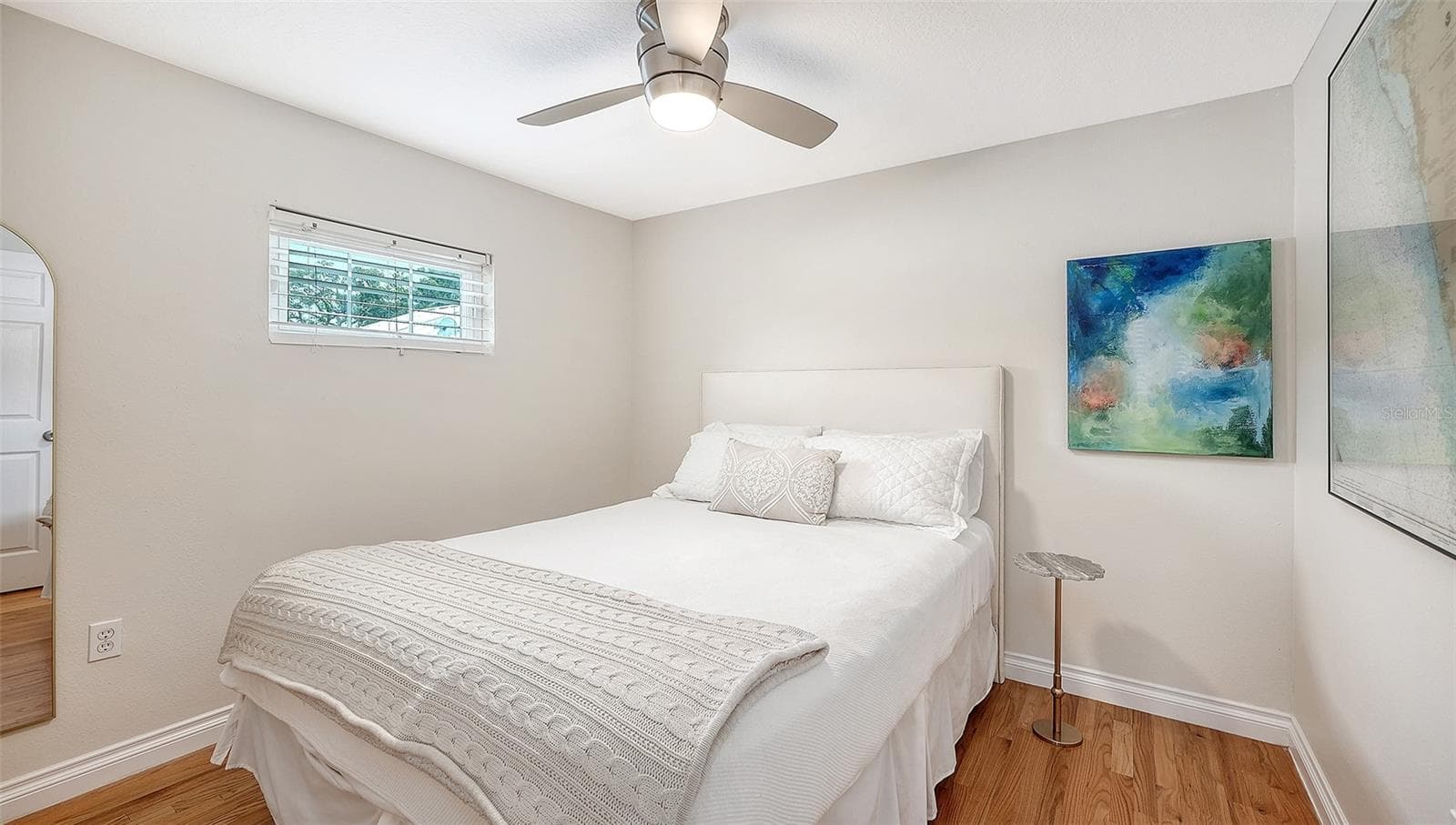 Comfortable bedroom 3 offers hardwood floors, generous natural light, and a tranquil, polished atmosphere. - 1685 6TH ST, SARASOTA