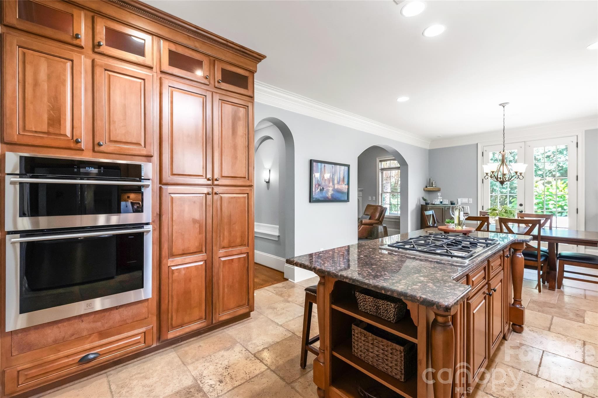 The kitchen opens up to a breakfast area, perfect for casual dining and everyday family meals. - 7320 Summerlin Place, Charlotte