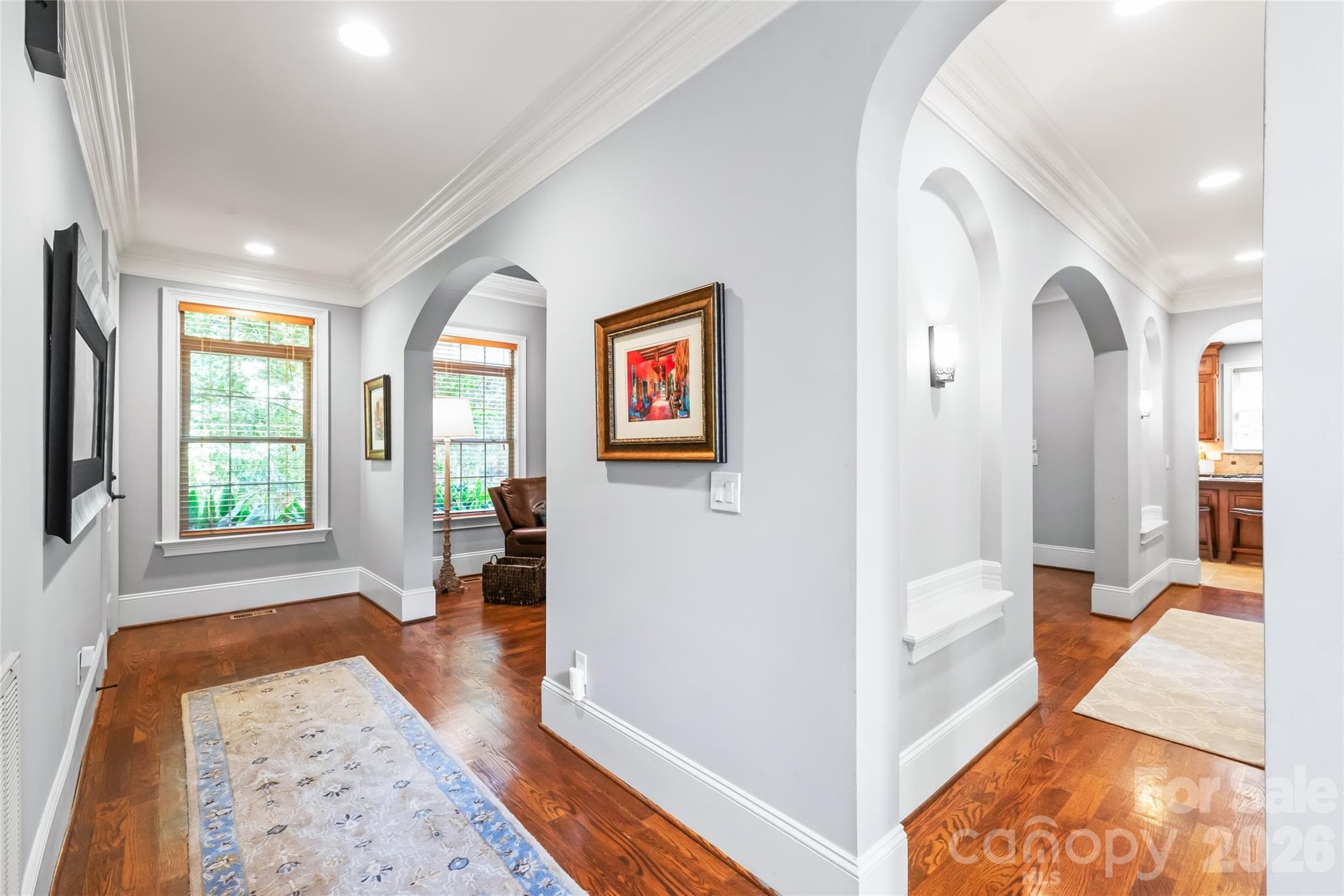 Substantial high-profile baseboards add a tall, custom look throughout the home, creating an atmosphere of grand proportions and tailored sophistication. - 7320 Summerlin Place, Charlotte