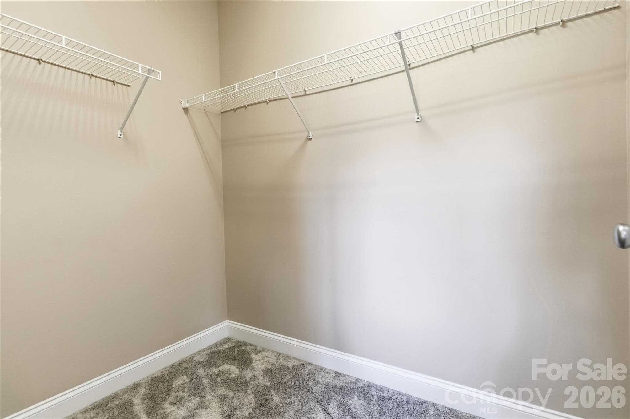 Walk-in closet in the second bedroom - 1000 E Woodlawn Road, Charlotte