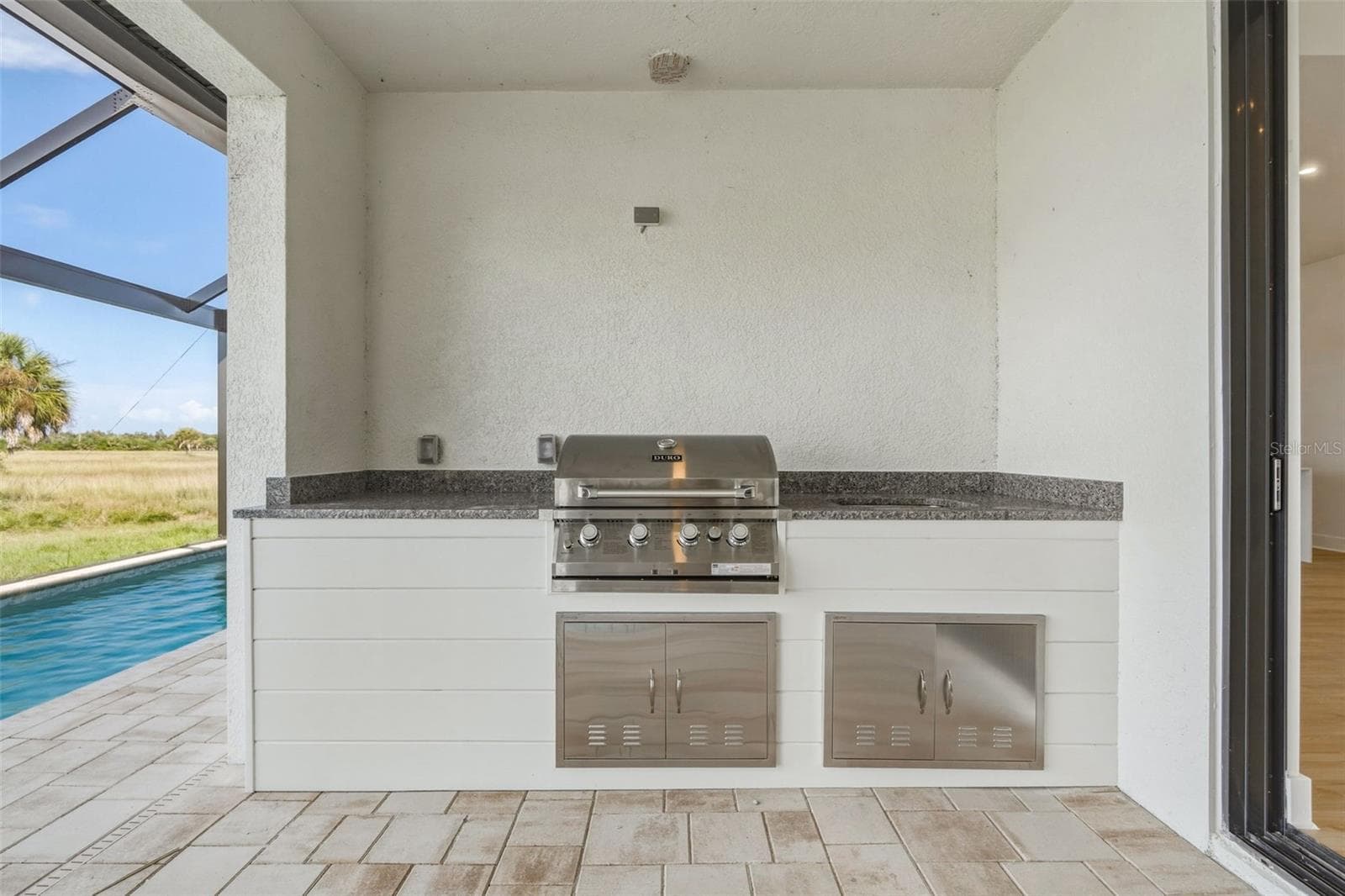 Covered Outdoor Kitchen with Built in Grill & Poolside Access - 44 SUNFLOWER DR, PLACIDA