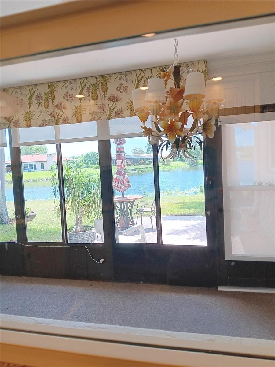 Looking out Kitchen window thru the lanai - 980 N GONDOLA DR, VENICE
