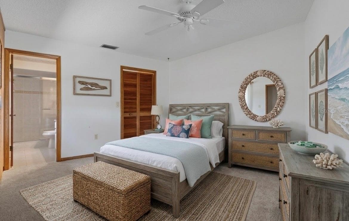 Staged photo of the master bedroom - 9009 HEATHER BLVD, WEEKI WACHEE
