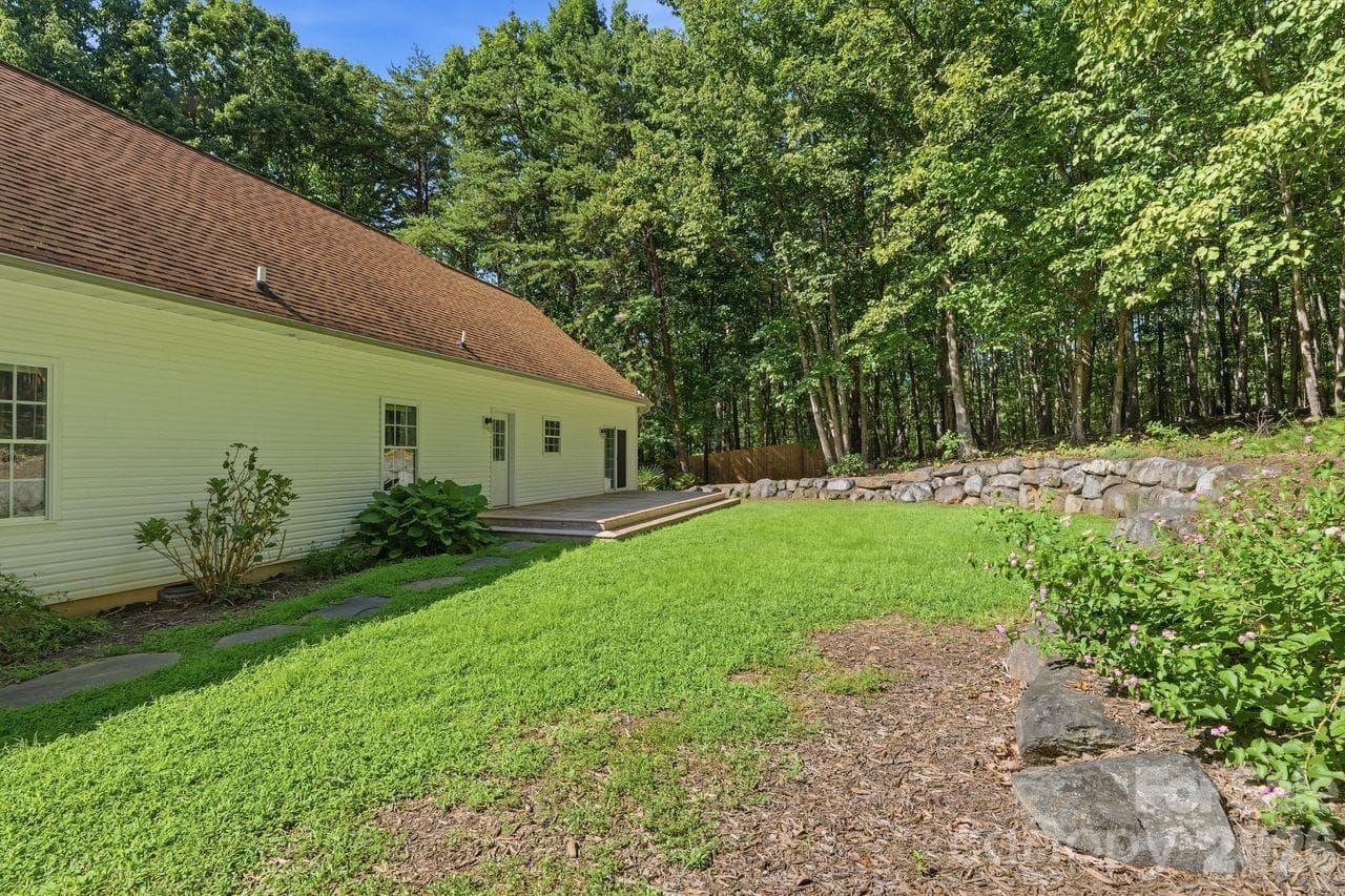 Rear yard with professionally installed rock wall - 5480 Liberty Hill Road W, York