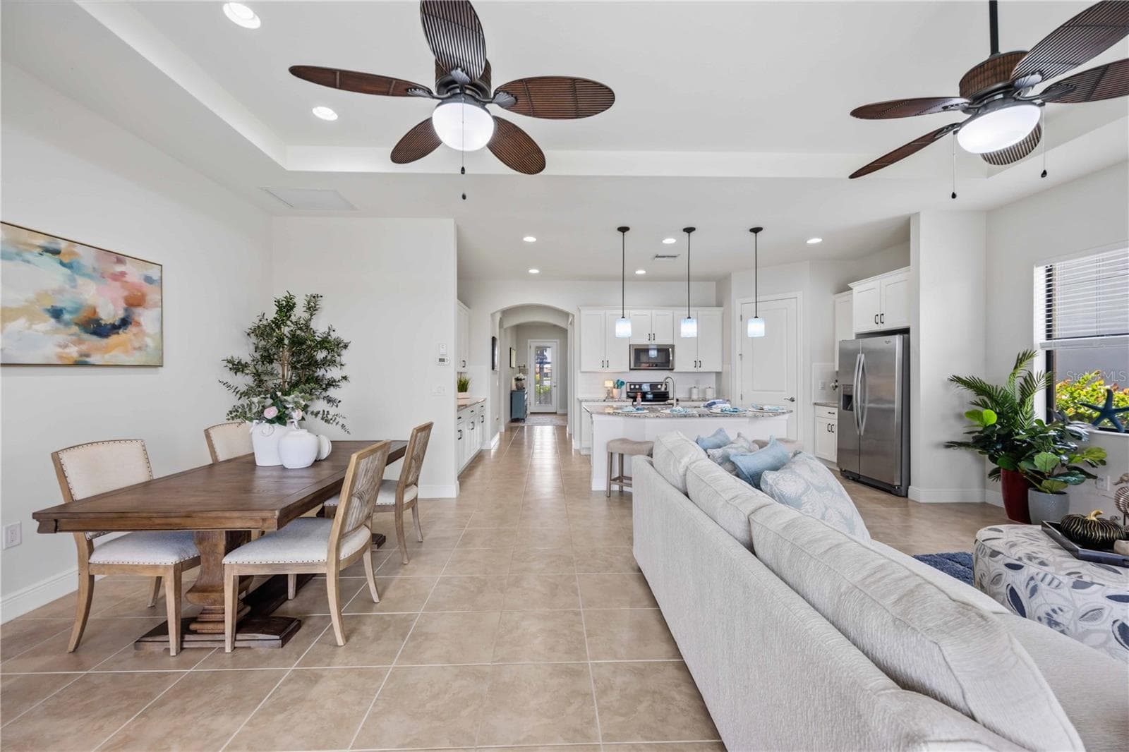 he living /great room in this home shares space with the dining area - - 23781 WAVERLY CIR, VENICE