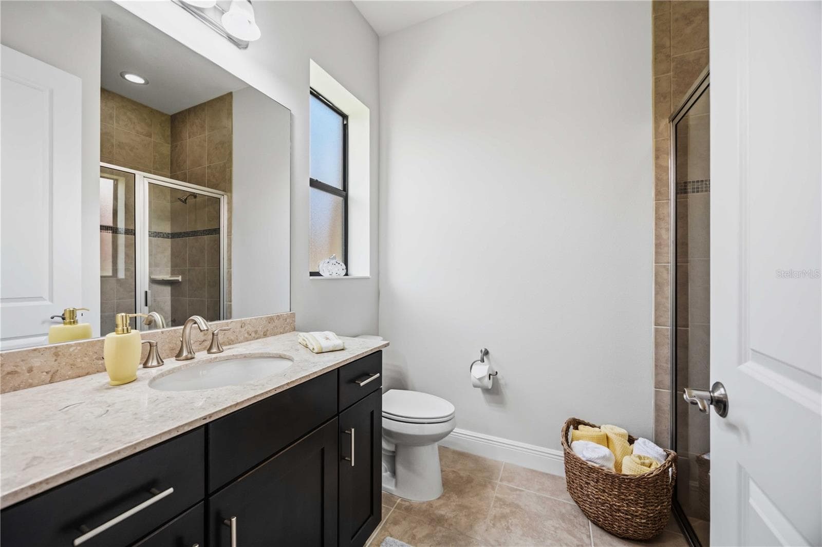 The ensuite in guest 2 has a walk in shower - 23781 WAVERLY CIR, VENICE