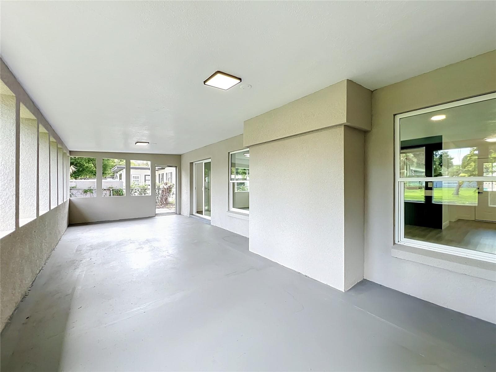 Plenty of covered space for dining, relaxing and entertaining overlooking the backyard. - 3202 TRADEWINDS TRL, ORLANDO