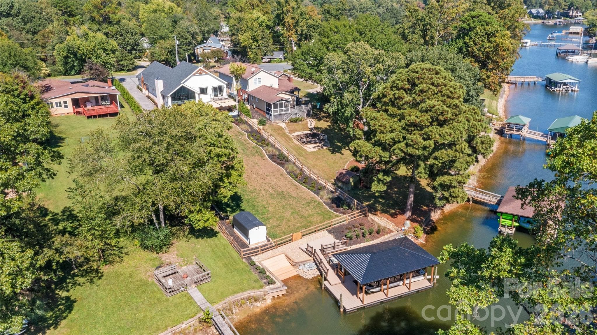 Covered dock with 5,000 lb capacity, front-mount boat lift. - 7834 Green Cove Court, Denver