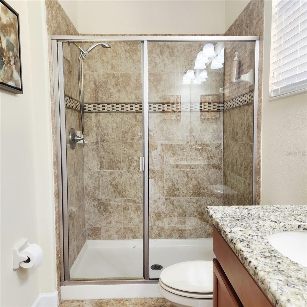Ensuite bathroom downstairs. - 8935 CUBAN PALM RD, KISSIMMEE