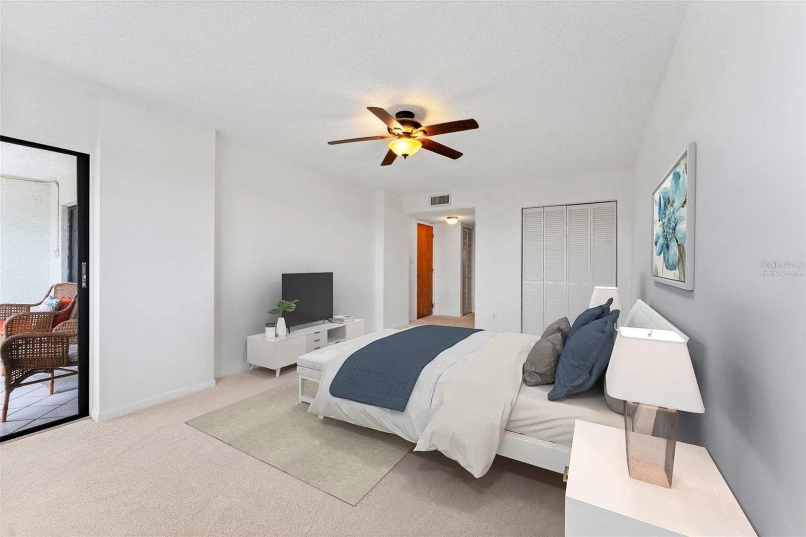 Virtually staged primary bedroom, there is room for a king sized bed as well as a sitting area here. This room is generous! - 5400 PARK ST N #511, ST PETERSBURG