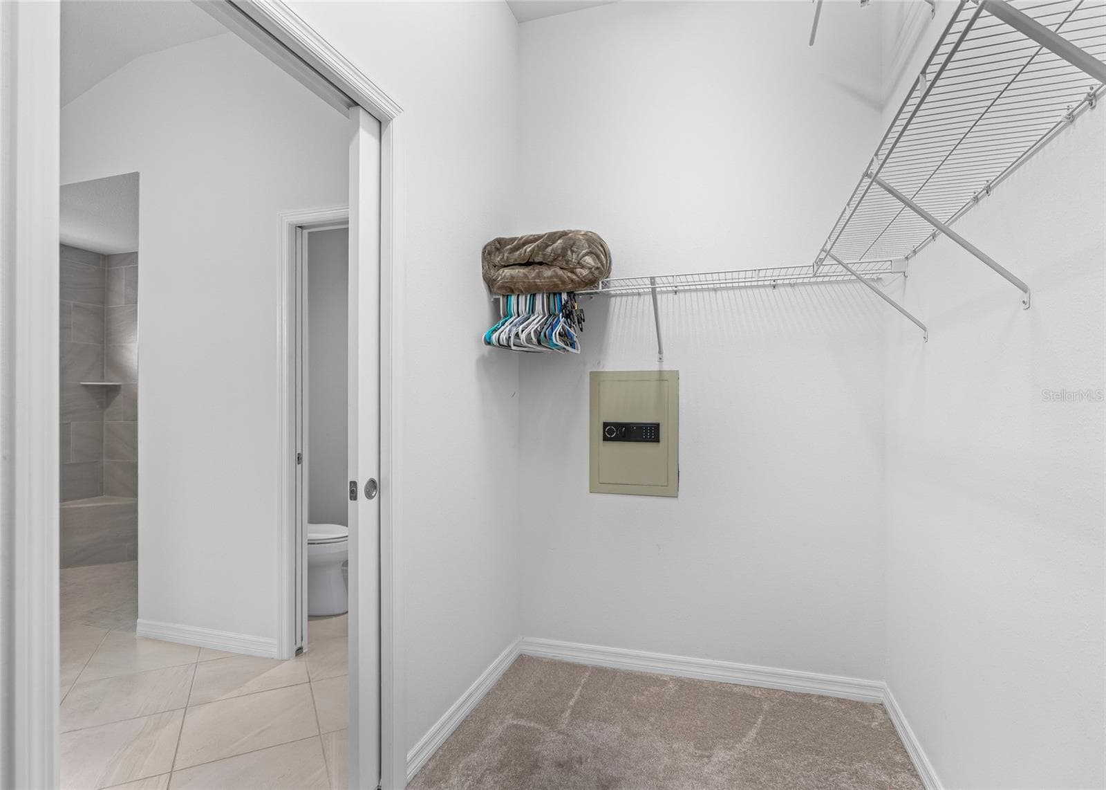 Primary Closet with Wall Safe - 3146 JACQUELINE WAY, THE VILLAGES