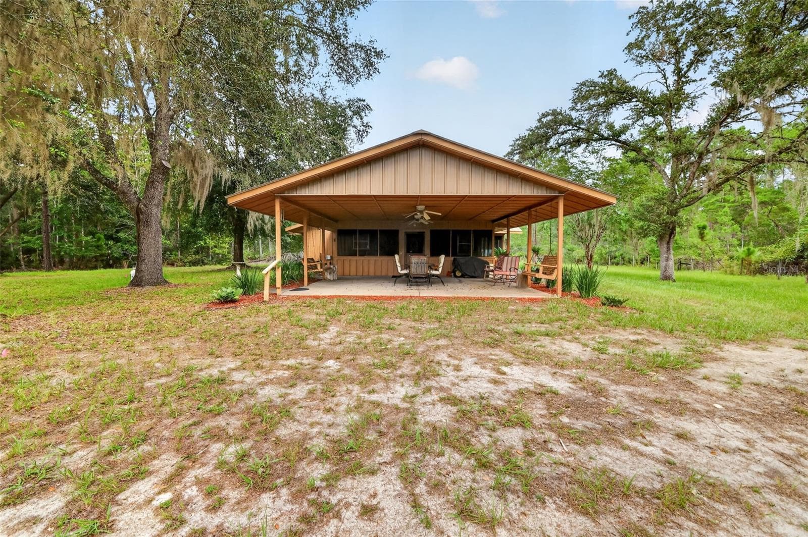 Front on long view of the 23' x 23' covered porch - 24939 OLD DEER RD, PAISLEY