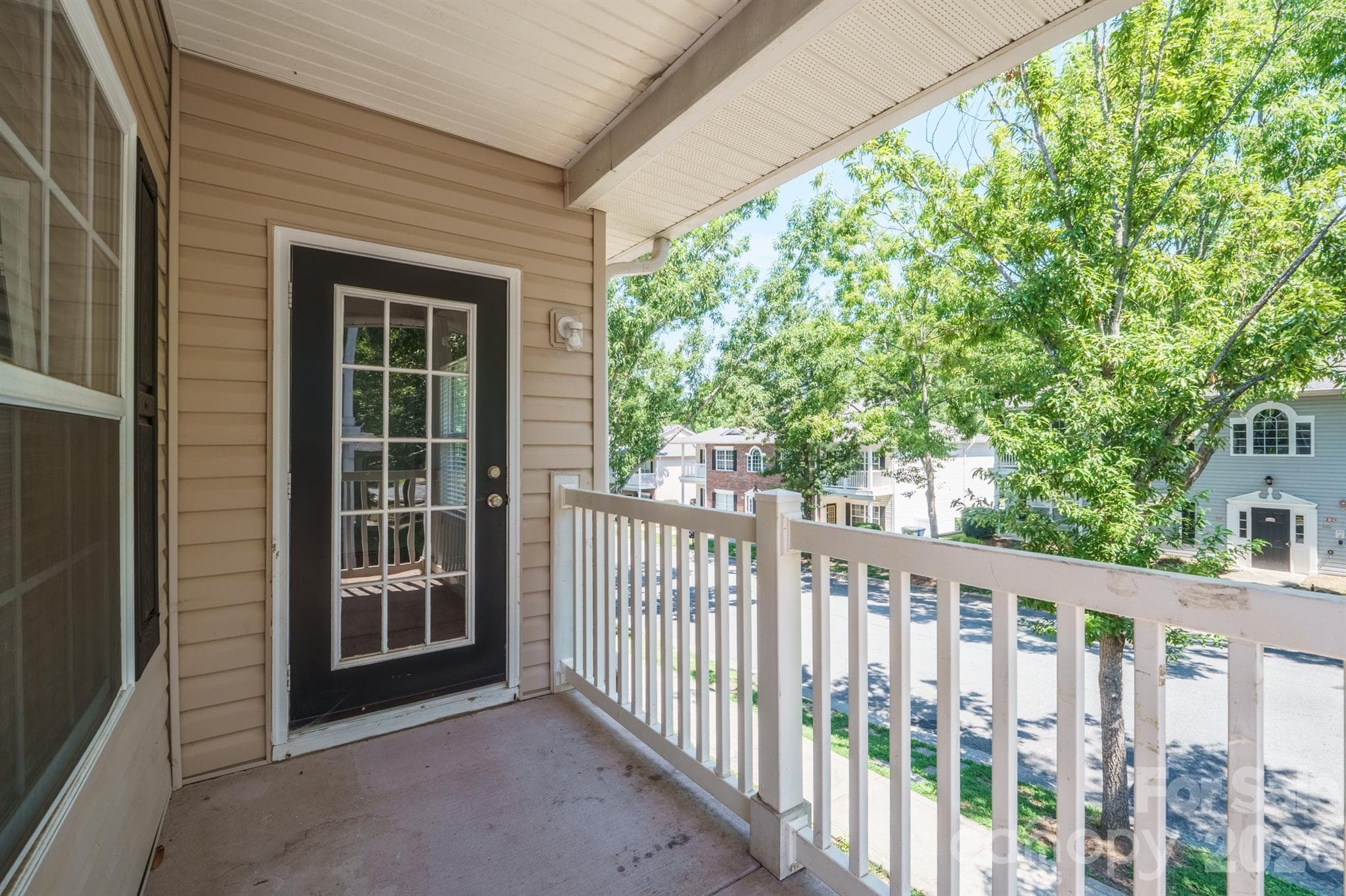 Front balcony where you feel your in the trees, shades the porch - 21246 Hickory Street, Cornelius