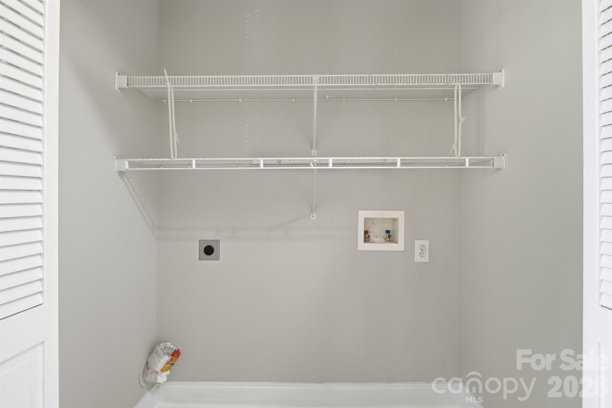 Laundry closet off kitchen hallway to back balcony - 21246 Hickory Street, Cornelius