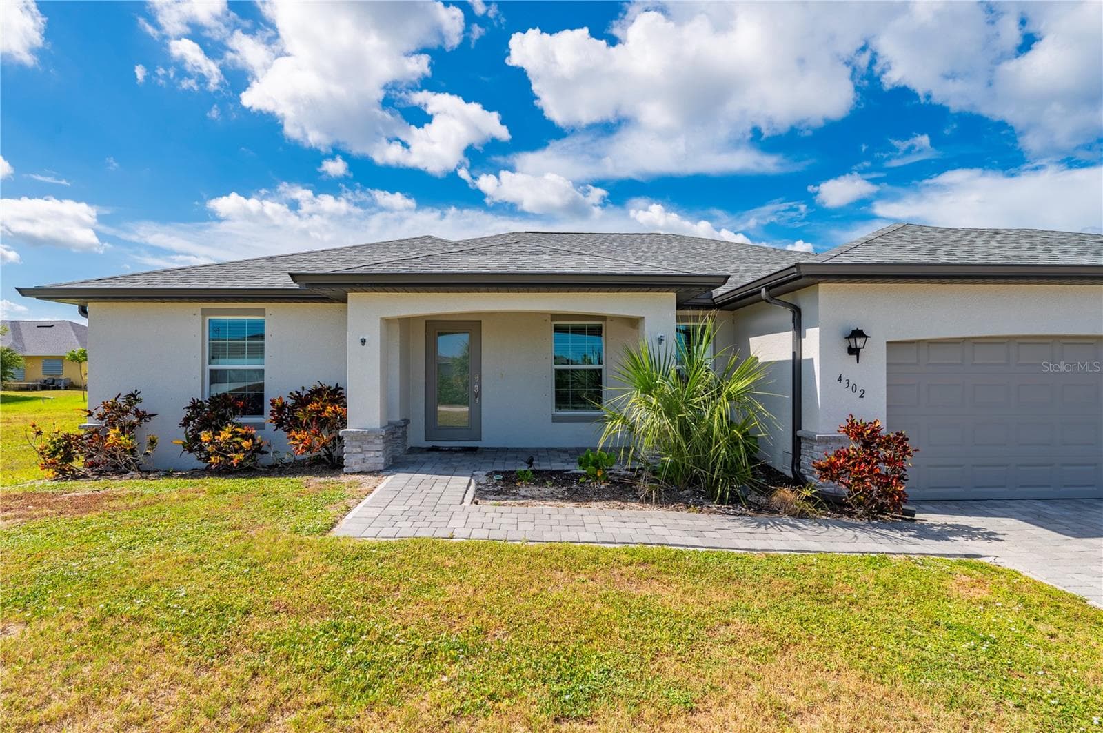 Outside View of Home with Pavered Driveway - 4302 NW 32ND ST, CAPE CORAL