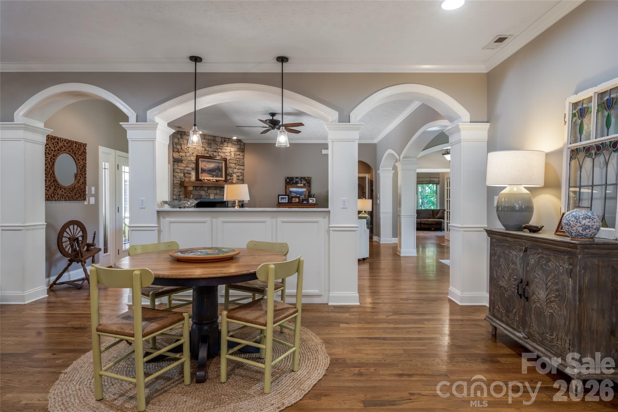 Breakfast area with kitchen to the right, living and dining room through the arches... - 170 Cape Martin Circle, Hendersonville