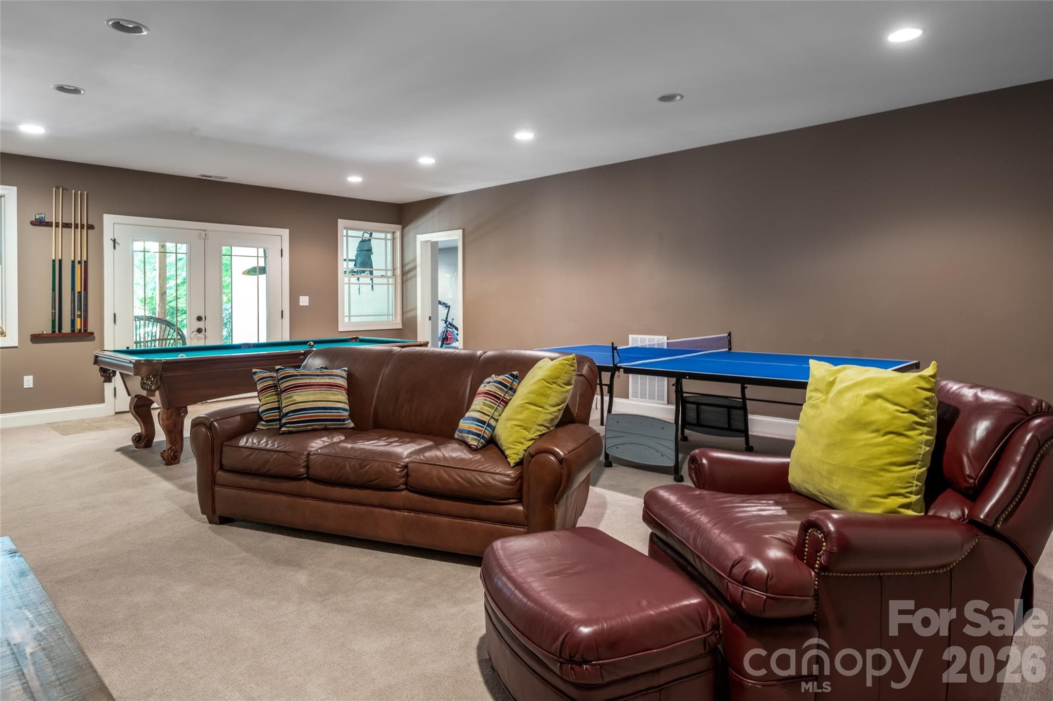 Doubled the size of the house by adding a downstairs that includes two large bedrooms, a full bath with a double sink, craft/video room, rec room, gym and storage - 170 Cape Martin Circle, Hendersonville