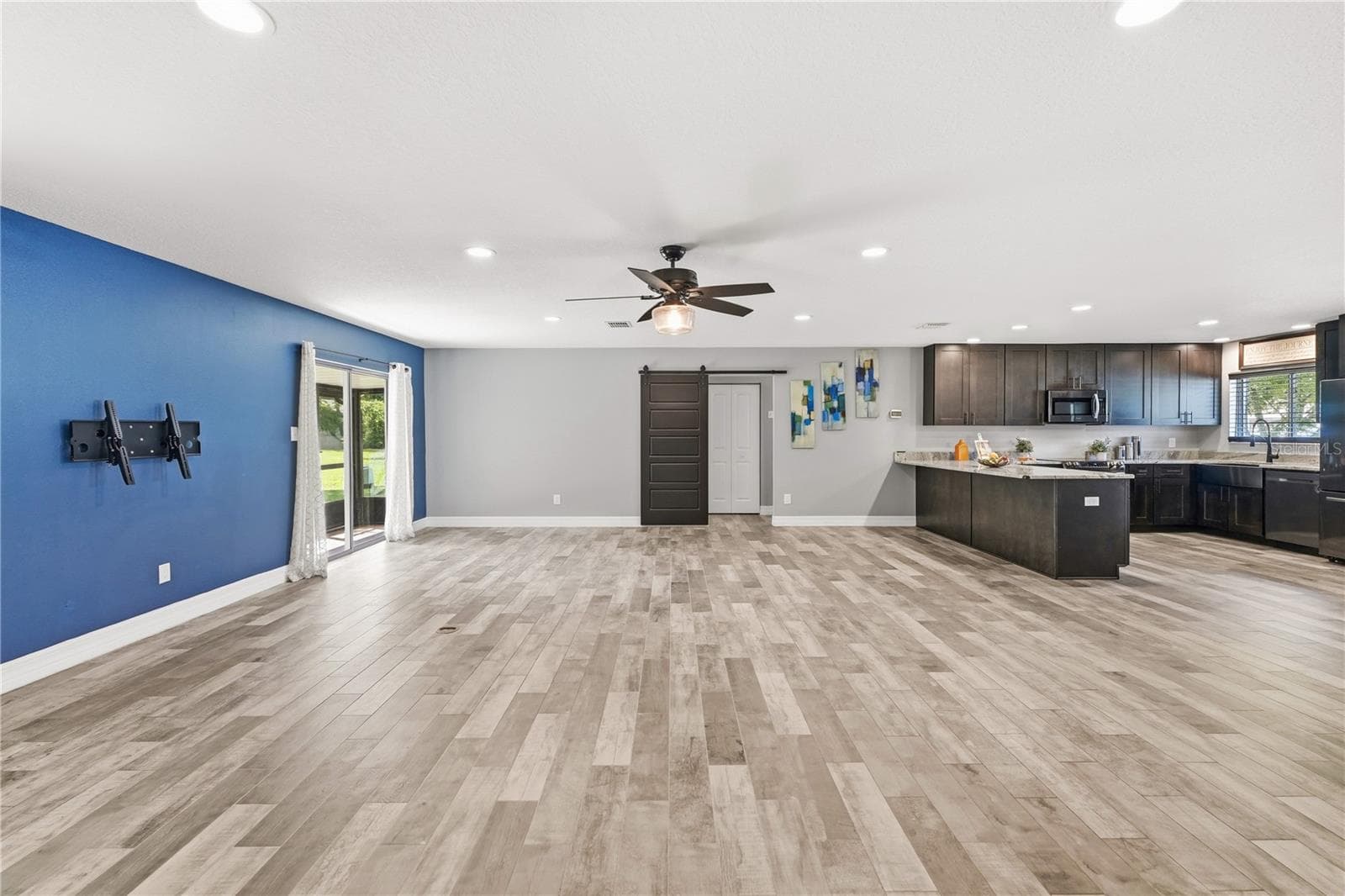 Expansive Living and Dining Room without furniture. - 10702 WILLIAM TELL DR, ORLANDO