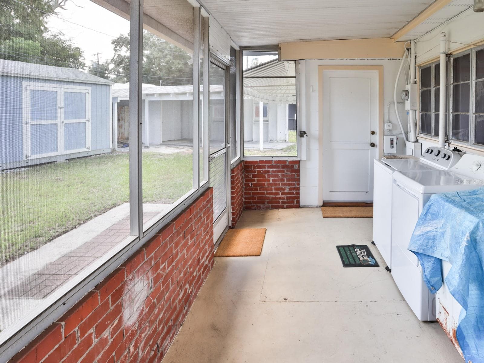 Back porch with washer and dryer. - 1855 E VALENCIA DR, BARTOW