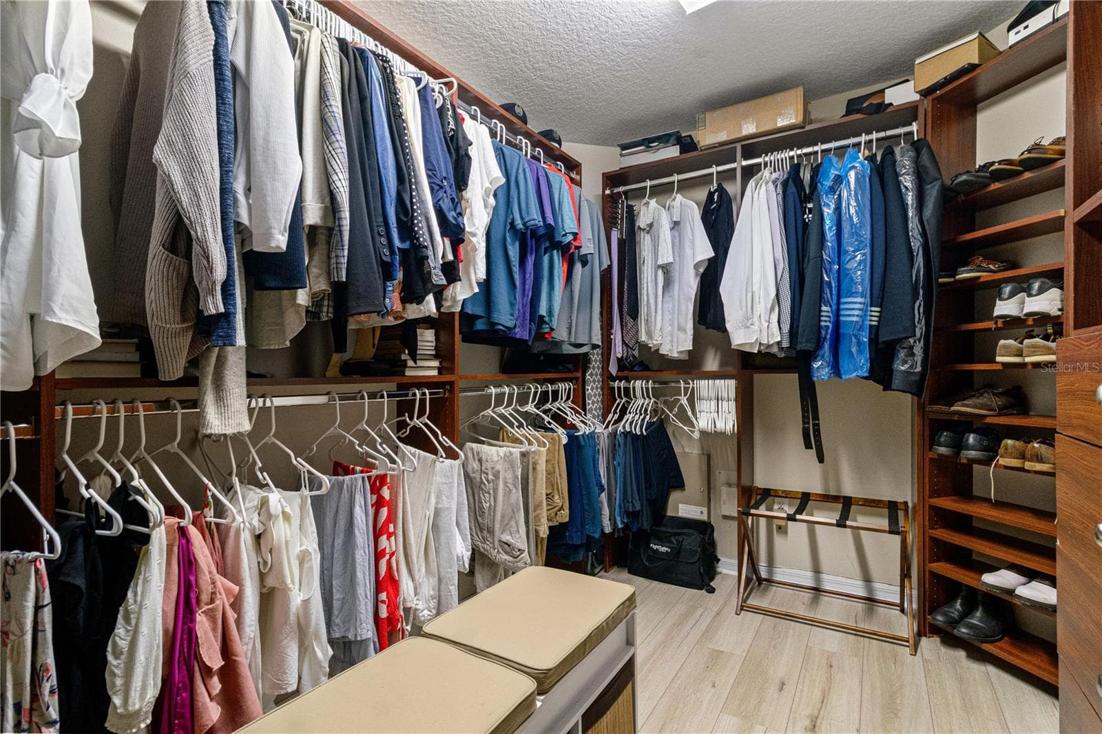 There is plenty of of hanging space in the primary closet - 5824 FISH CROW PL, LAND O LAKES