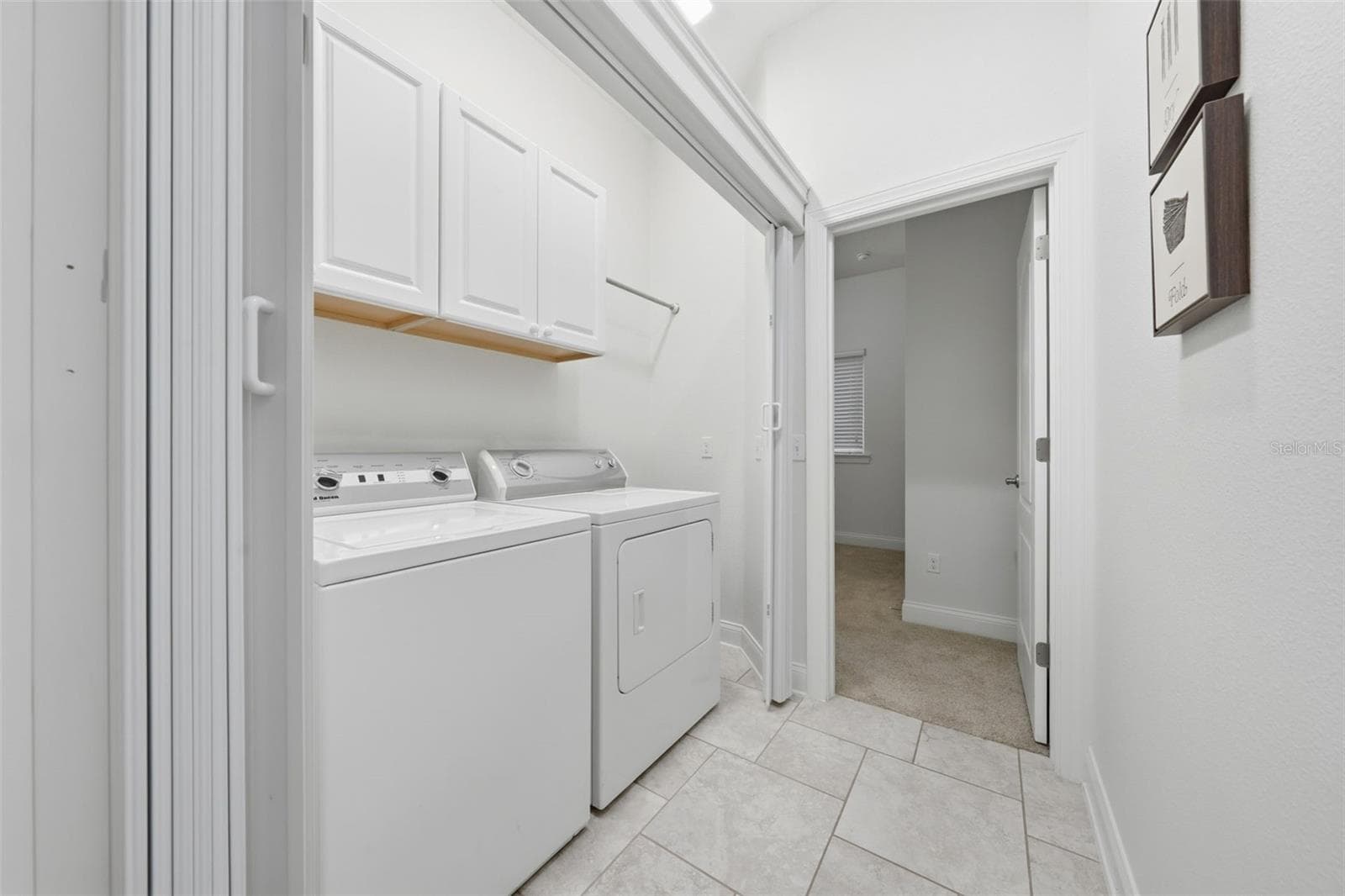 Laundry area leading into Guest Suite - 16716 ABBEY HILL CT, CLERMONT