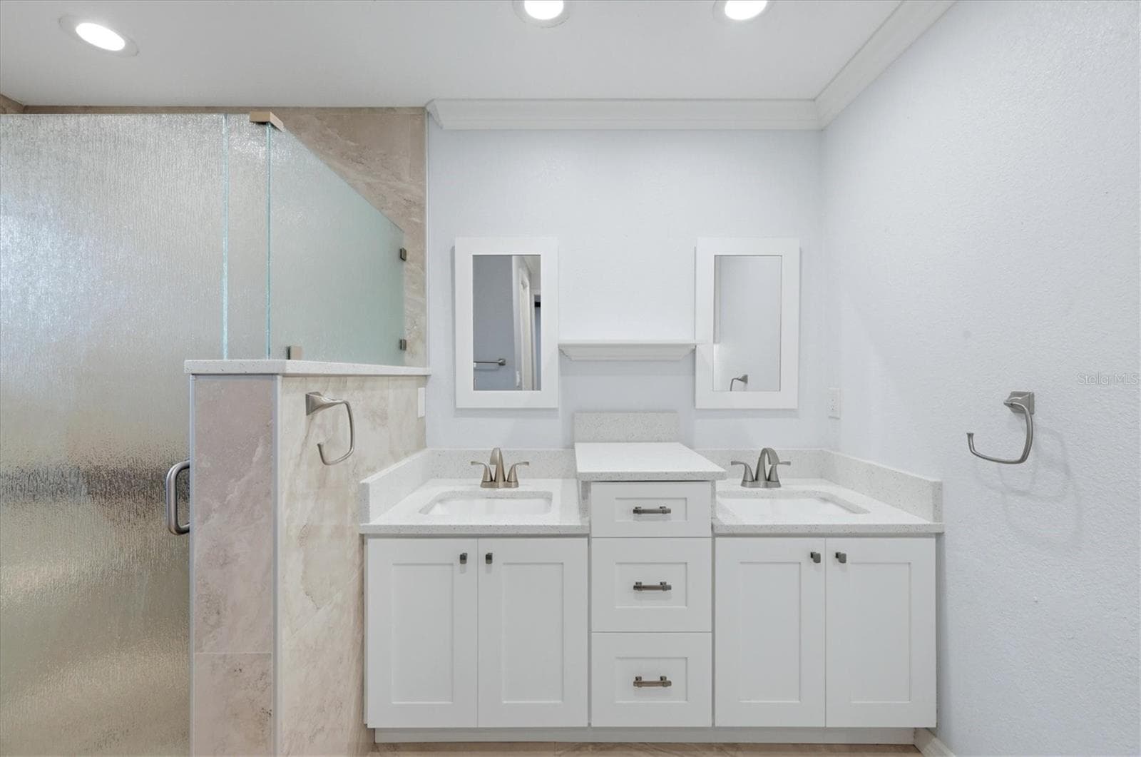 Primary bathroom has been updated with modern cabinetry, quartz counters, ceramic tile and walk-in shower with a bench. - 259 PARK FOREST BLVD, ENGLEWOOD