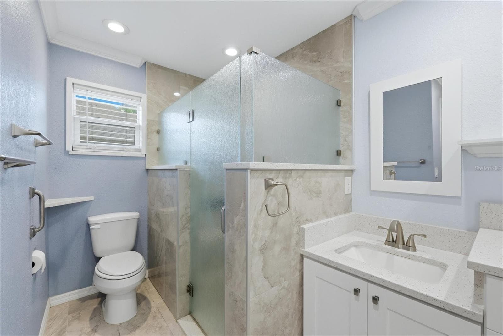 Primary bathroom has a large walkin shower with glass enclosure and seating bench. - 259 PARK FOREST BLVD, ENGLEWOOD